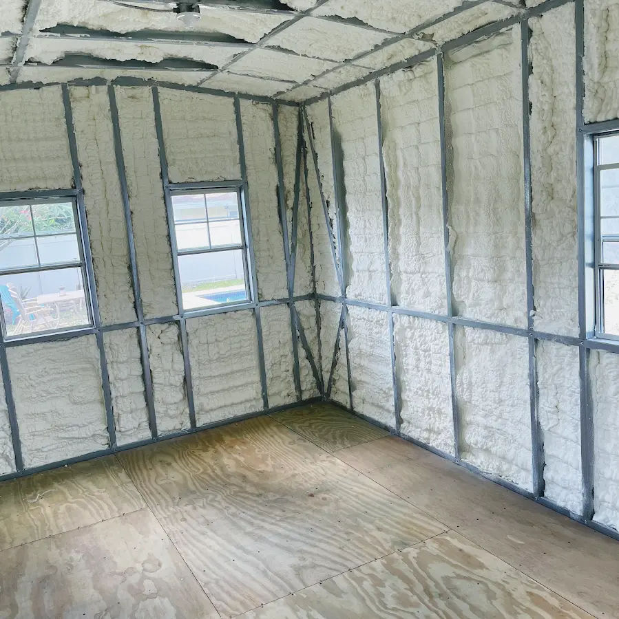 Closed-cell spray foam insulation applied to wall cavities in a residential project in Brown Deer